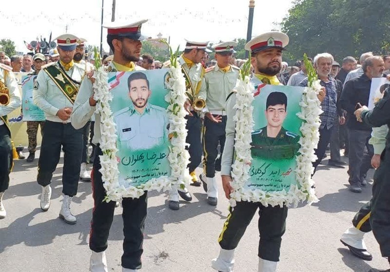 علی‌آبادکتول 2 فرزند شهیدش را در آغوش گرفت+تصاویر