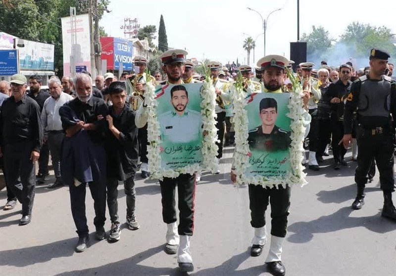 علی‌آبادکتول 2 فرزند شهیدش را در آغوش گرفت+تصاویر